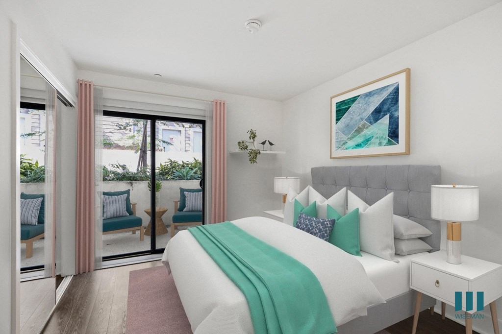 Bedroom with Mirrored Closet and Patio