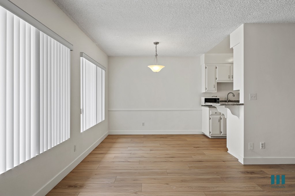 Dining Space with Large-Size Windows and Vinyl Flooring