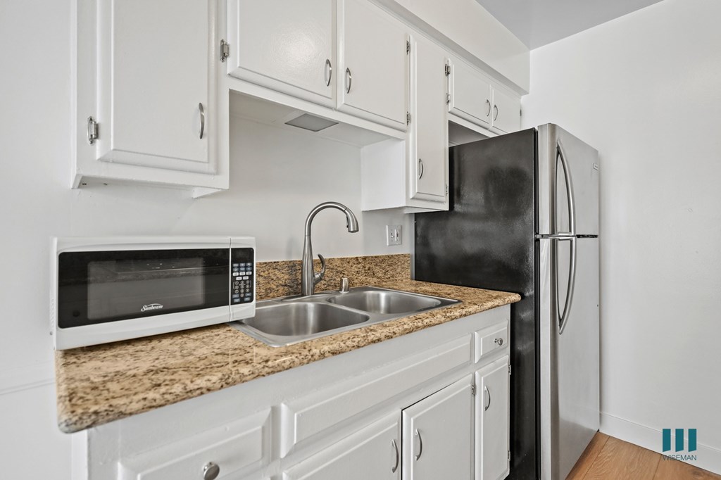 Kitchen with Refrigerator, Microwave, and Cabinet Storage