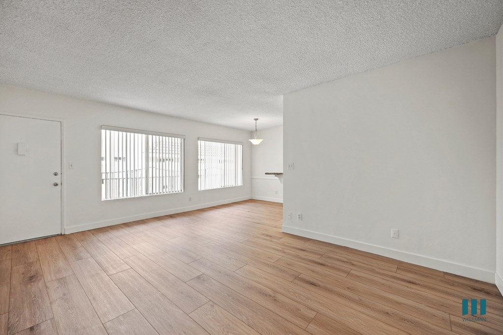 Spacious Living Room with Vinyl Flooring and Large-Size Windows