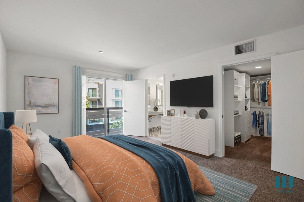 Bedroom with Walk-In Closet with Built-In Organizers, Bathroom, and Balcony