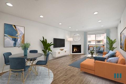 a living room with a couch and a table and a fireplace