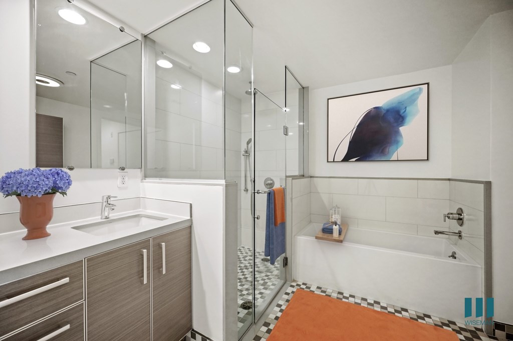 Bathroom with a Walk-In Shower, Full-Size Bathtub, and Double-Sink Vanity with Cabinet Storage