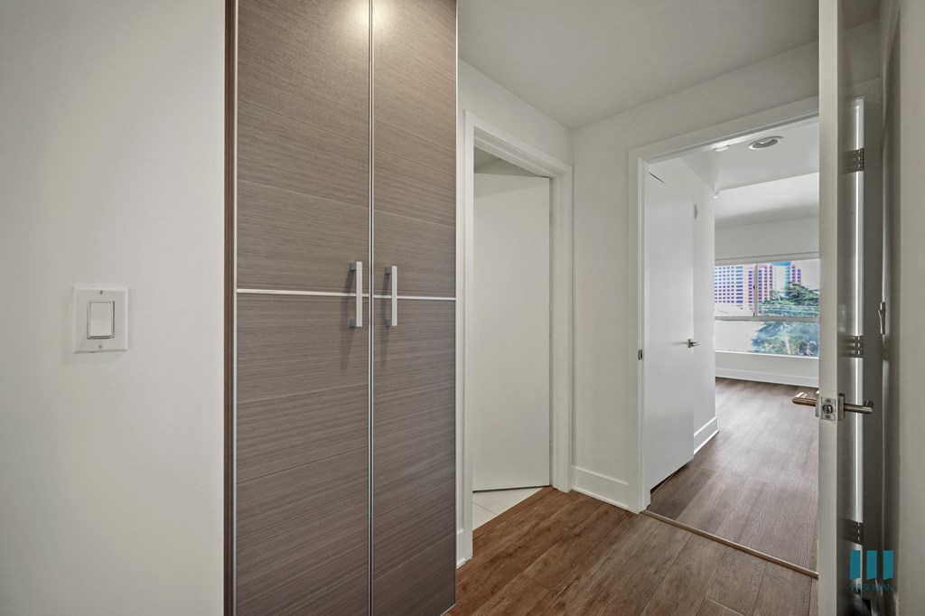 A white door is open to a hallway.