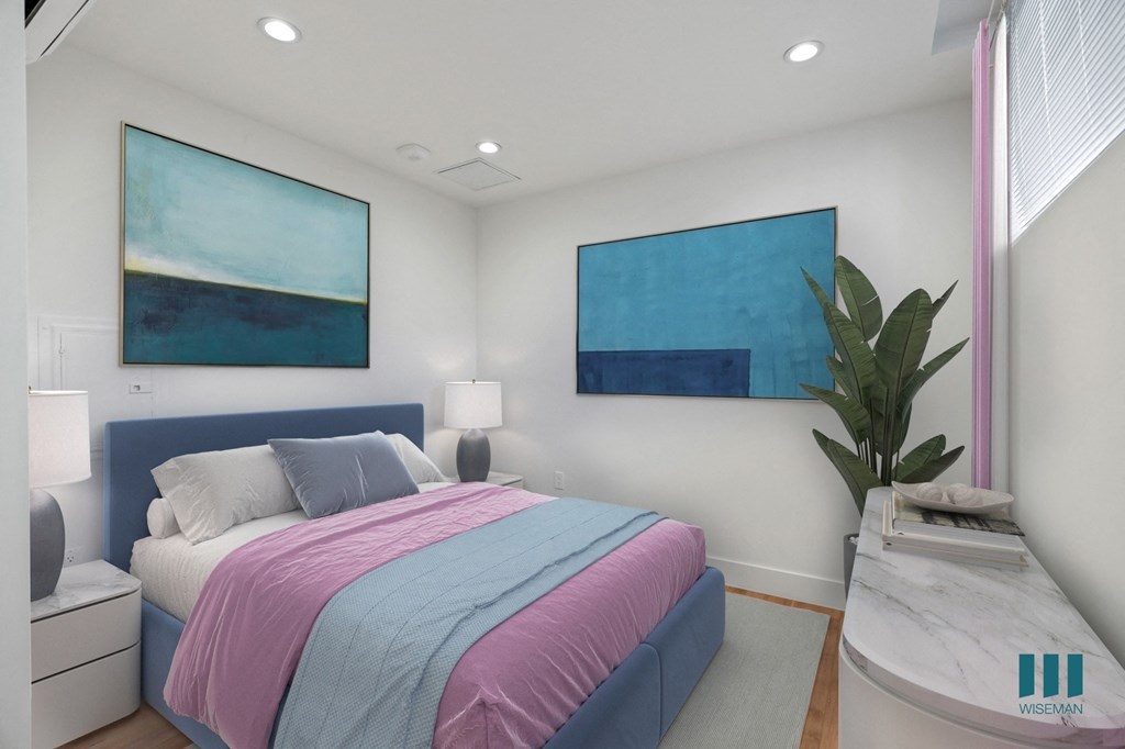 Studio bedroom with Vinyl Flooring, Recessed Lighting, and Windows