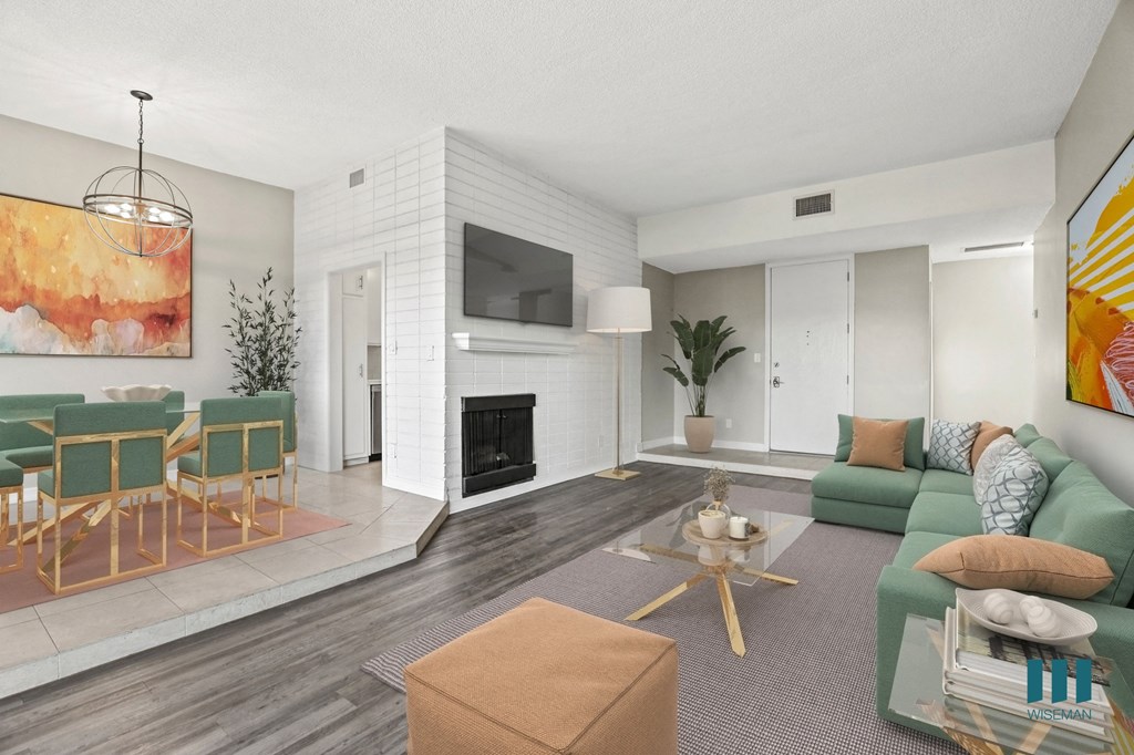 Open-Concept Dining and Living Room Area with Electric Fireplace