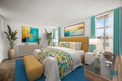 A bedroom with a large bed and a painting on the wall.