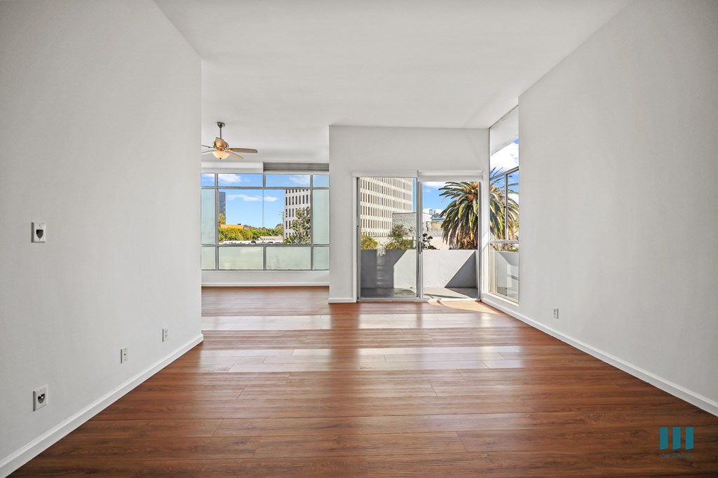 Spacious Open-Concept Living Room, Dining Area, and Patio