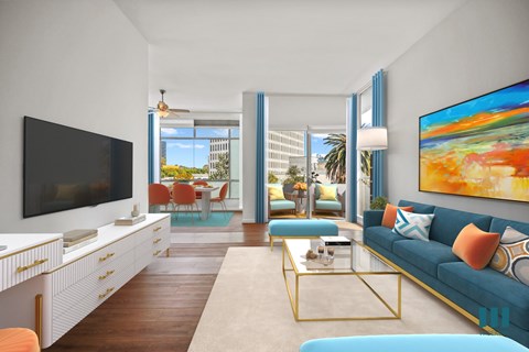 A living room with a blue couch and a television.