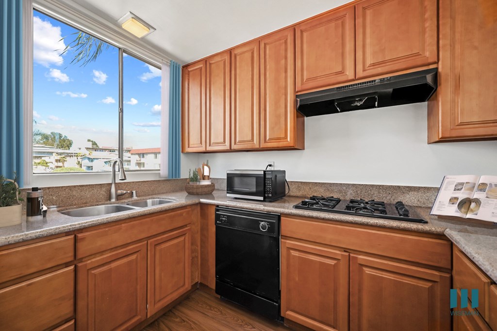 Kitchen with Gas Range, Dishwasher, and Microwave