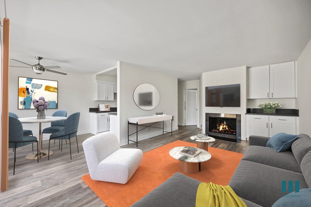 Open-Concept Dining and Living Room with Fireplace and Vinyl Flooring