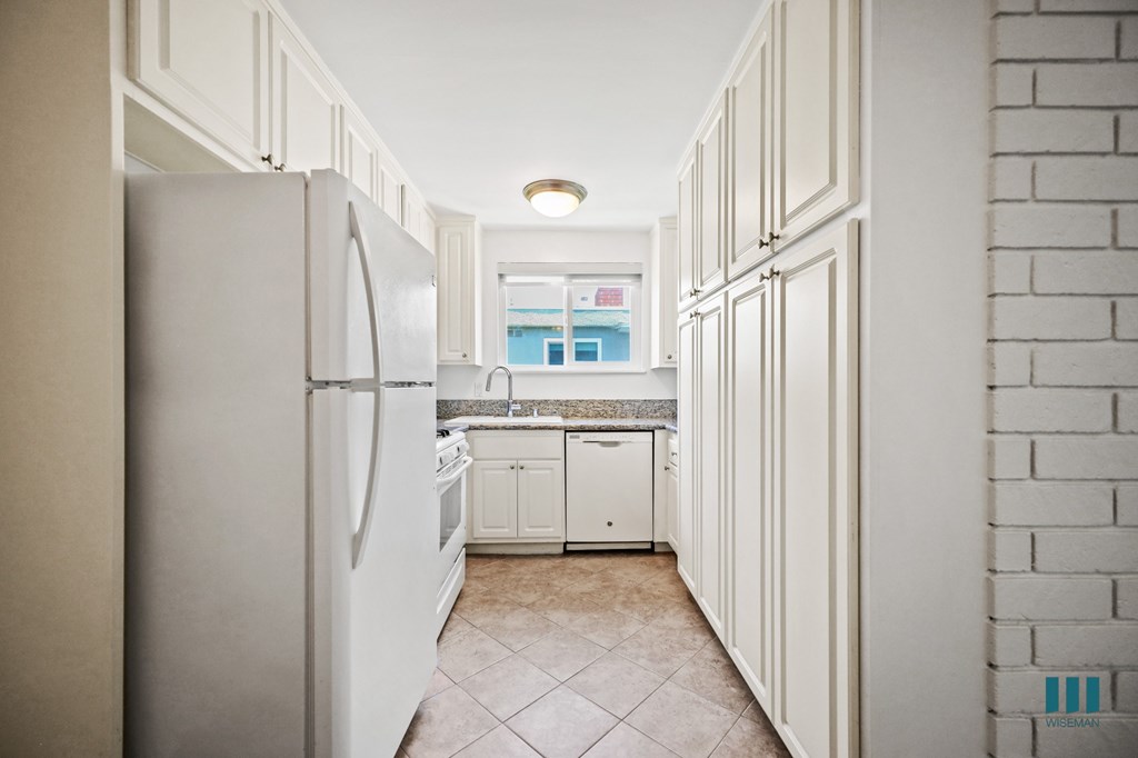 Kitchen with Refrigerator, Stove, Dishwasher, and Ample Cabinet Storage