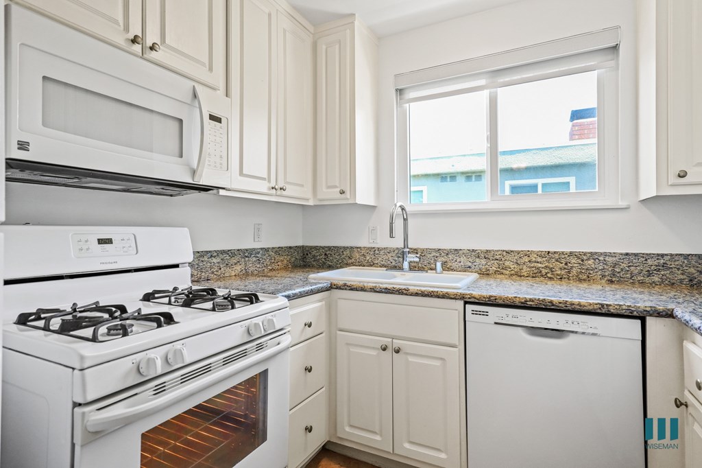 Kitchen with Refrigerator, Stove, Dishwasher, and Microwave Oven