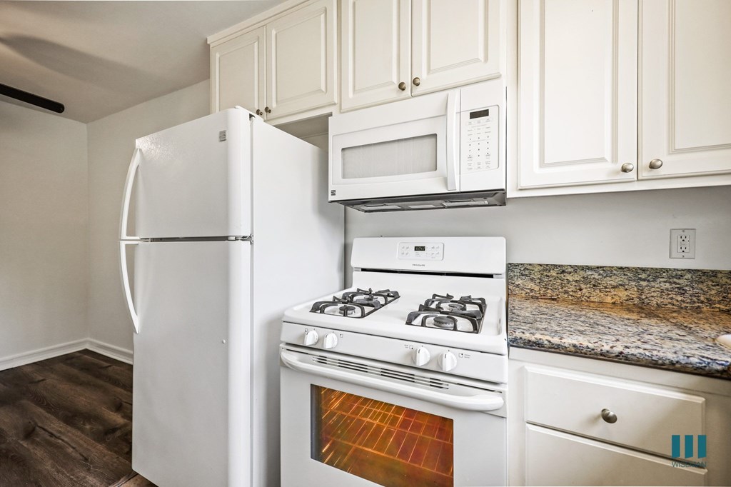 Kitchen with Refrigerator, Stove, and Microwave Oven