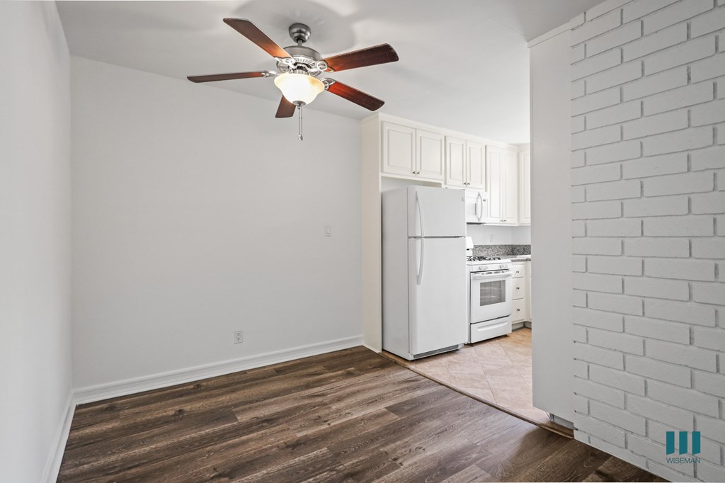 Dining Room with Overhead Ceiling Fan and Vinyl Flooring