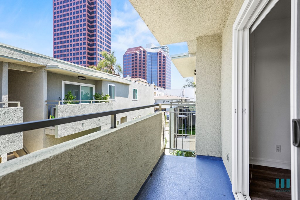 A balcony with a view of the city.