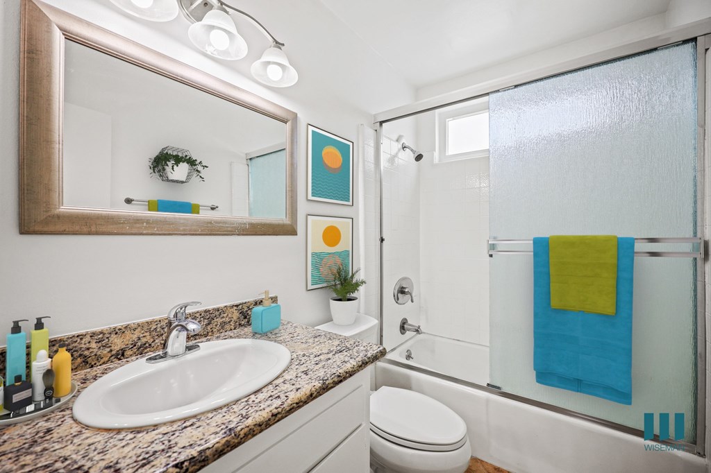 Bathroom with Shower Bath with Glass Door and Vanity Cabinet Storage