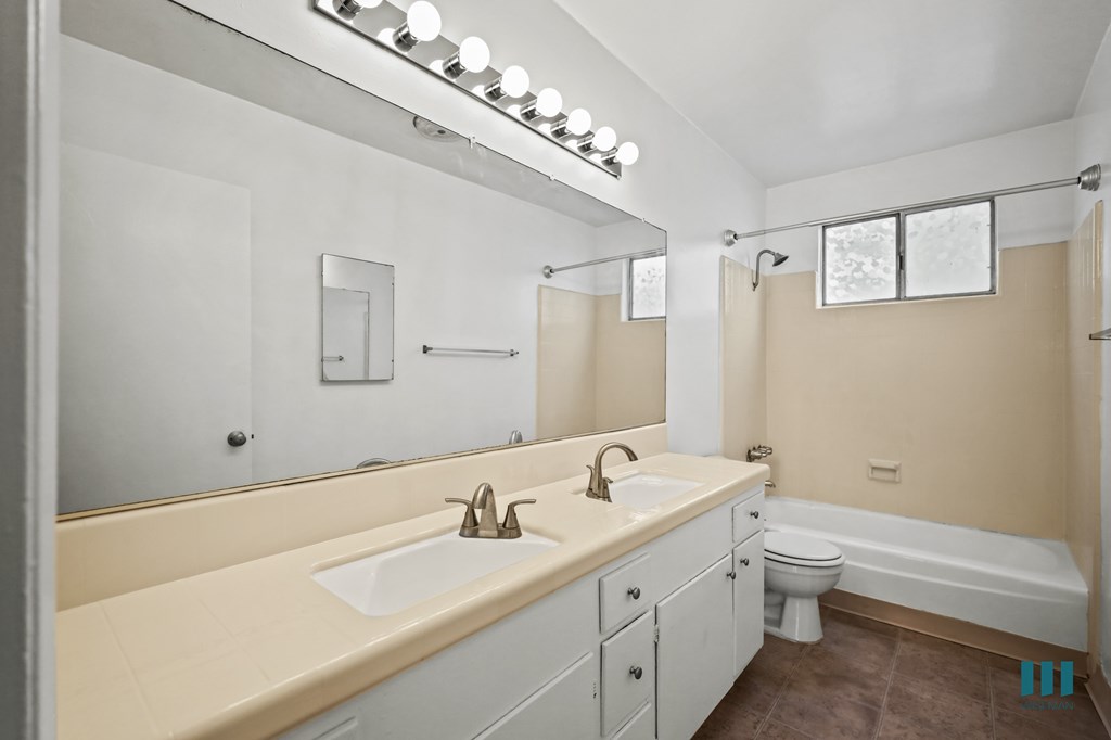 Bathroom with a Shower-Bath and Vanity Cabinet Storage