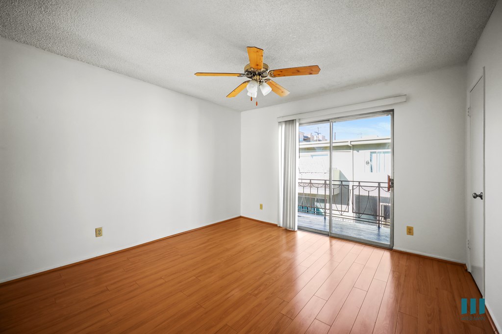 Living Room with a Ceiling Fan, Vinyl Flooring, and Patio