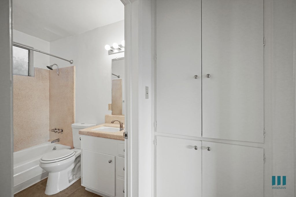 Hall Cabinets and Bathroom with a Shower-Bath and Vanity Cabinet Storage