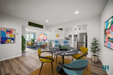 A modern dining room with a round table and chairs.