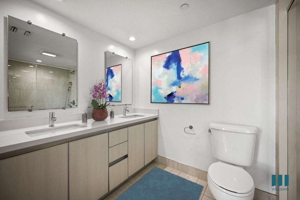 Spacious Bathroom with Double-Sink Vanity and Cabinet Storage