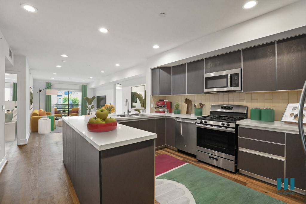 Open-Concept Kitchen, Dining, and Living Room with a Patio