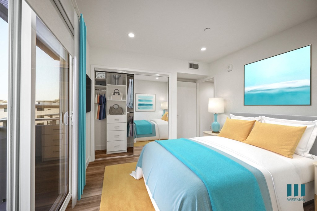 A bedroom with a large bed and a painting of a beach on the wall.