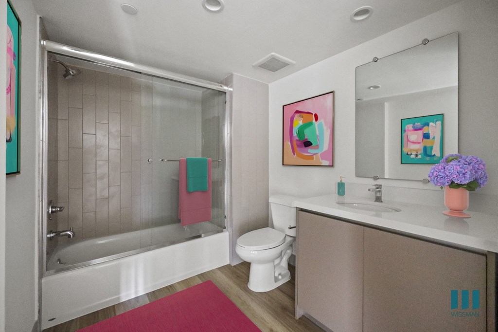 Bathroom with Shower-Bath with Glass Door and Vanity Cabinet Storage
