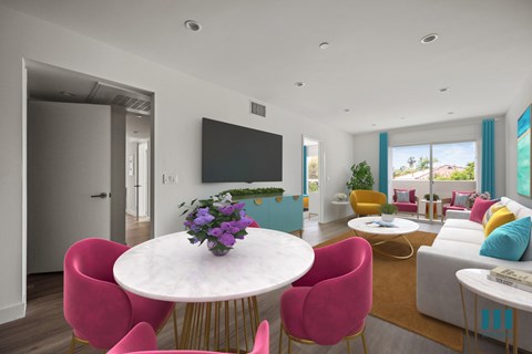A modern living room with a white table and pink chairs.