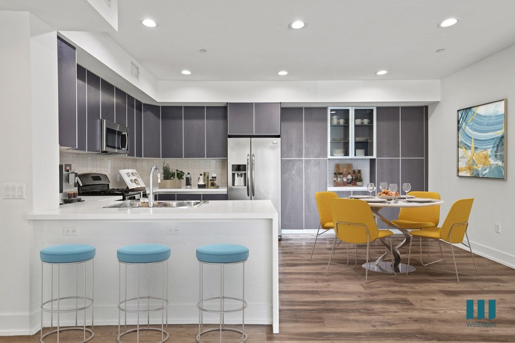 Open-concept Kitchen with Countertop Bar and Dining Area