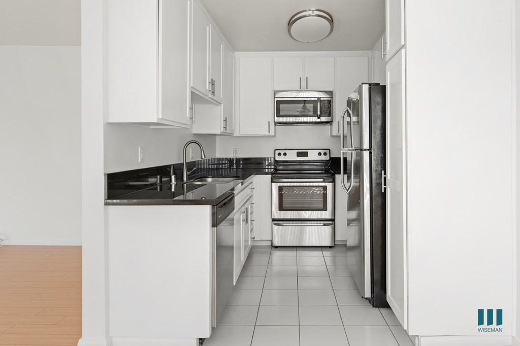 Kitchen with Stainless-Steel Refrigerator, Stove, Microwave Oven, and Dishwasher