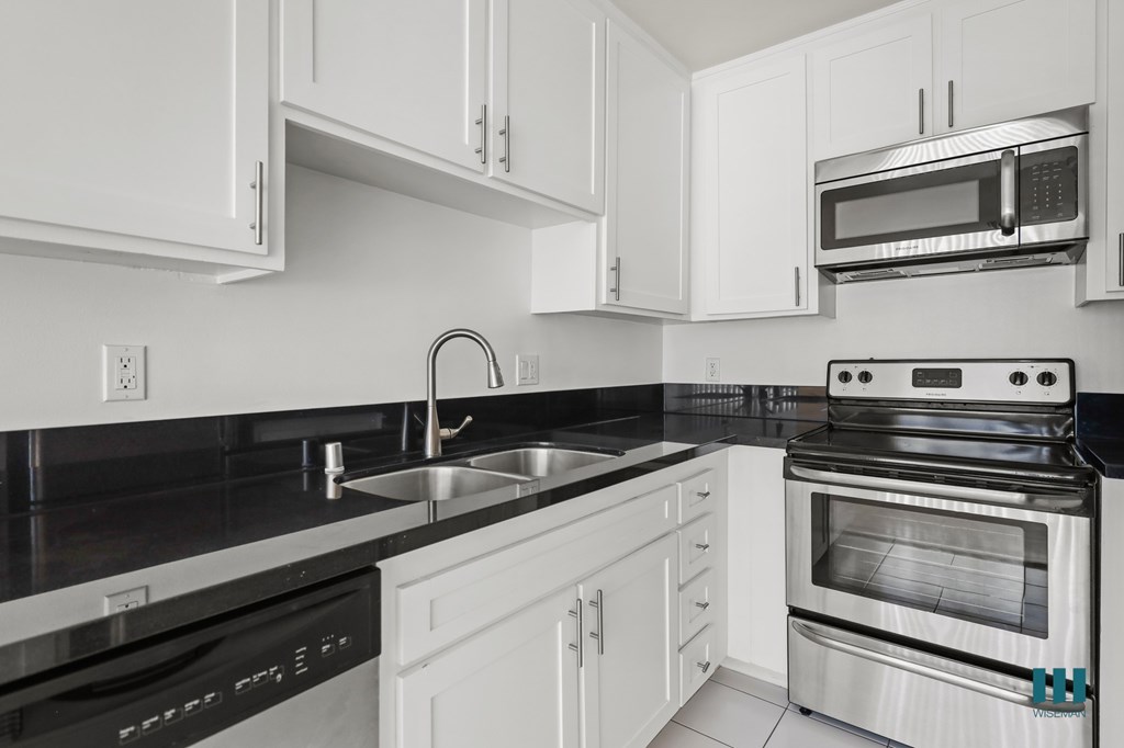 Kitchen with Dishwasher, Stove, Microwave Oven, and Refrigerator