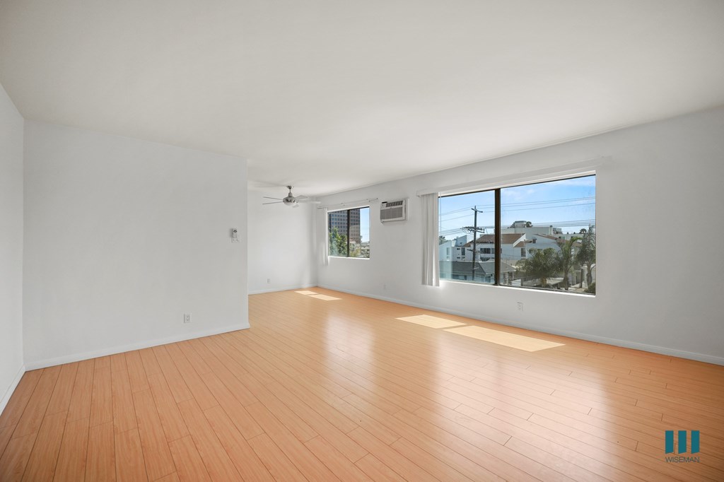Large-Size Open-Concept Living and Dining Room with Natural Light and Vinyl Flooring