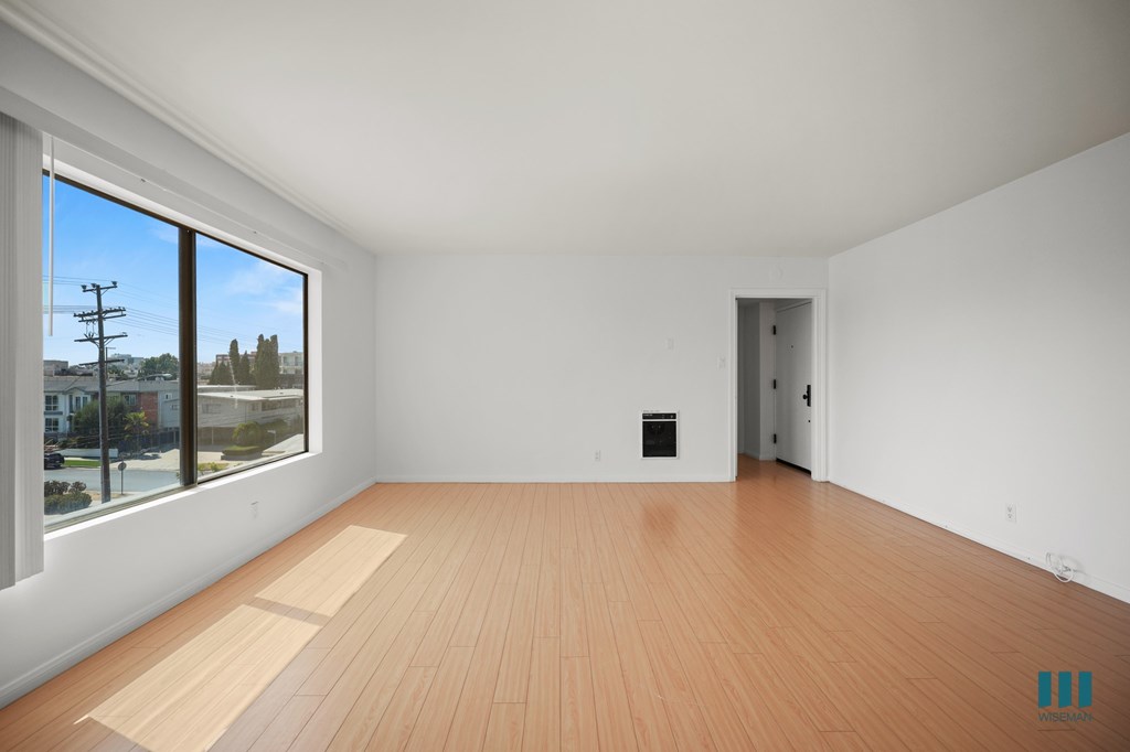 Living Room with Large-Size Windows and Vinyl Flooring
