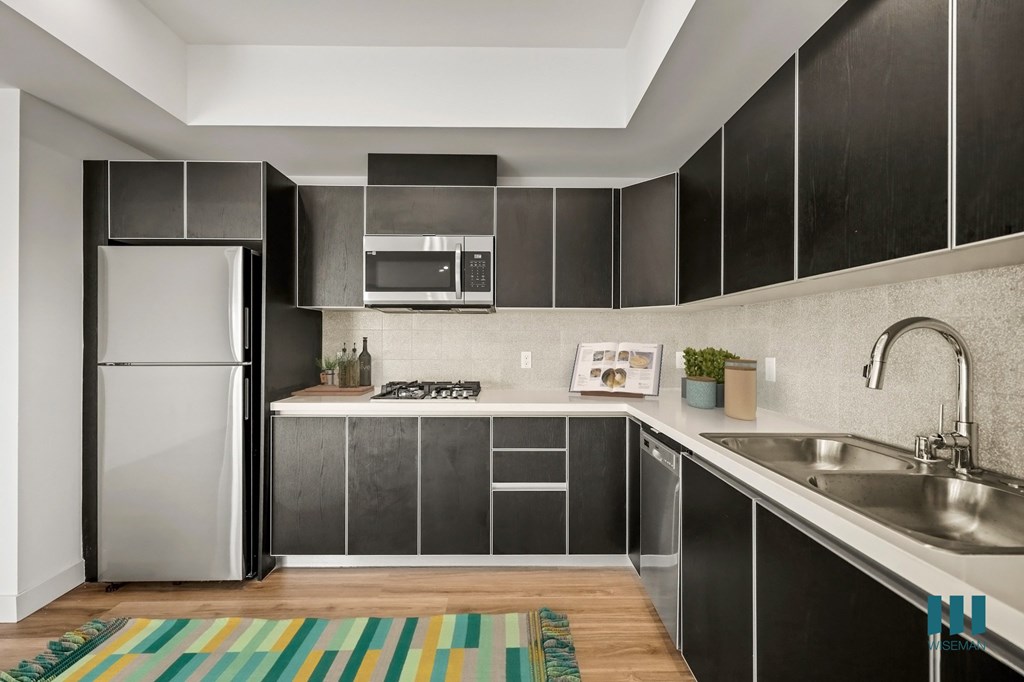 Kitchen with a Stainless-Steel Refrigerator, Range Stovetop, Dishwasher, and Microwave Oven - Bamboo Floor Plan