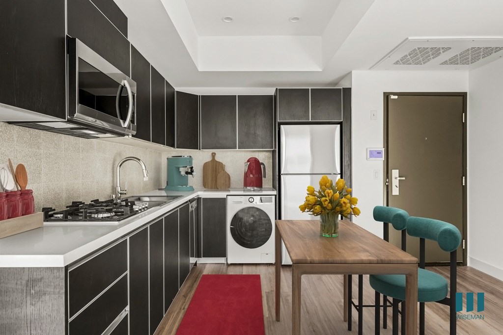 Open-Concept Kitchen with Refrigerator, Dishwasher, Washer/Dryer, Range Stovetop, and Microwave Oven - Palm Floor Plan