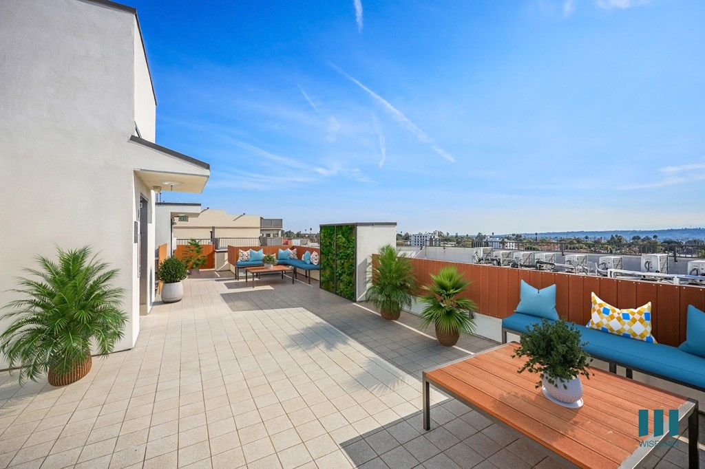 Rooftop Deck with Entertainment Space and Views of the City
