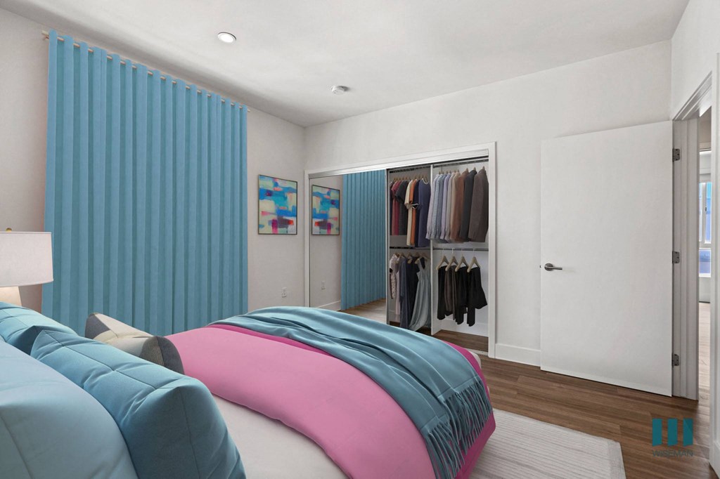 Bedroom with Vinly Flooring, Recessed Lighting, and Mirrored Closet