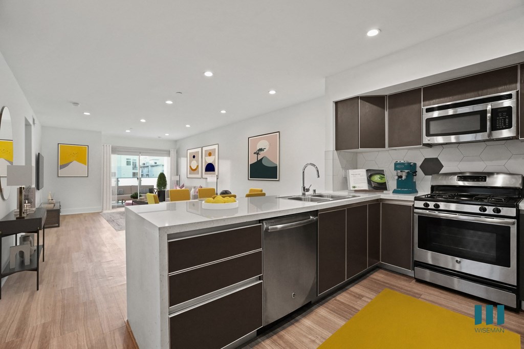 Open-Concept Kitchen, Dining, and Living Room with Patio