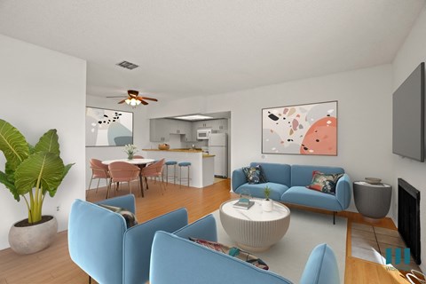 A living room with blue chairs and a white coffee table.