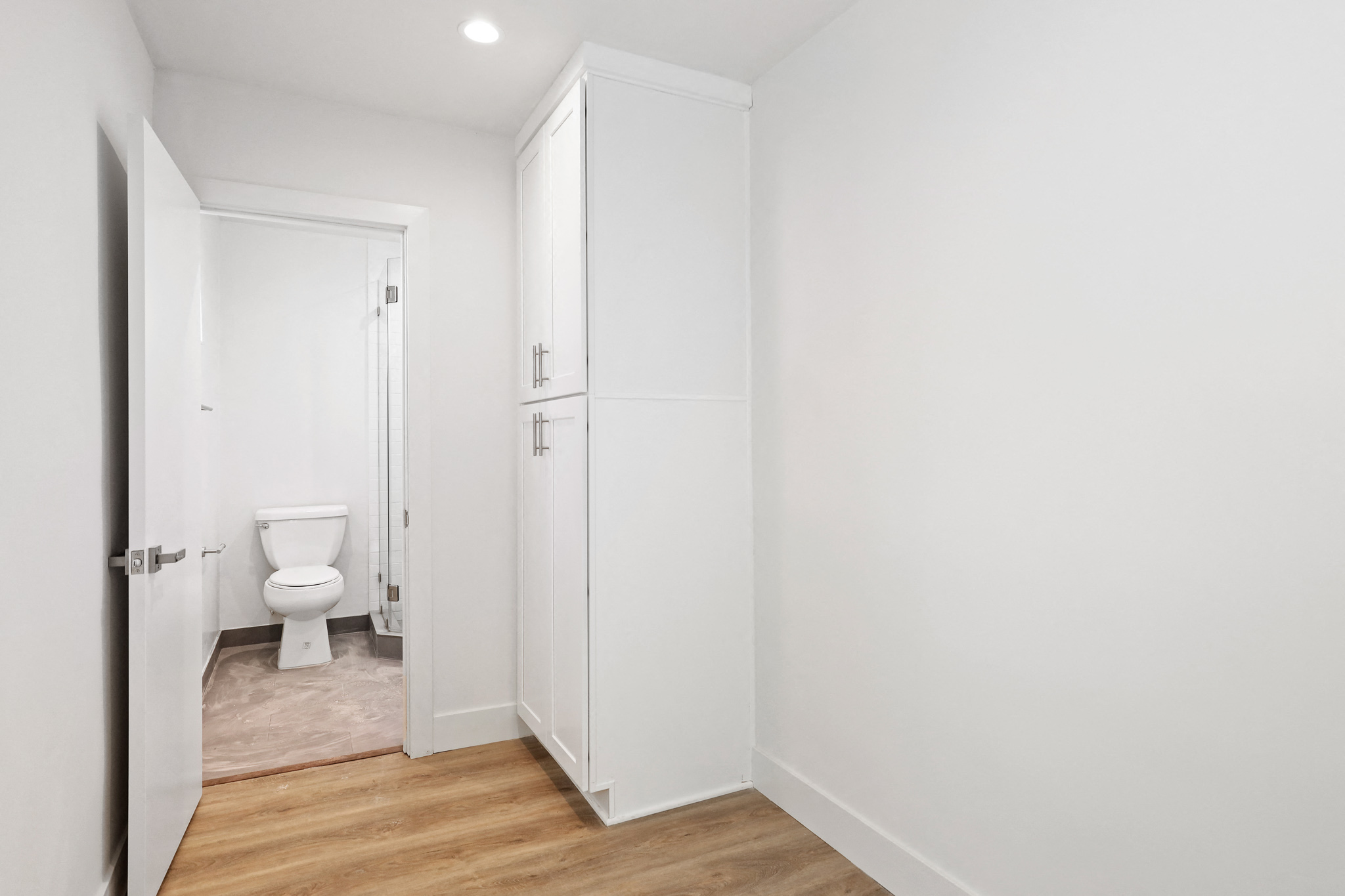 Studio Apartment Bedroom with Storage Cabinet and Full-Size Bathroom