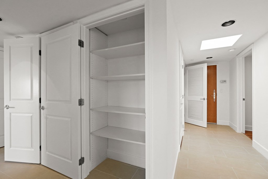 Hall Closet with Built-In Shelving