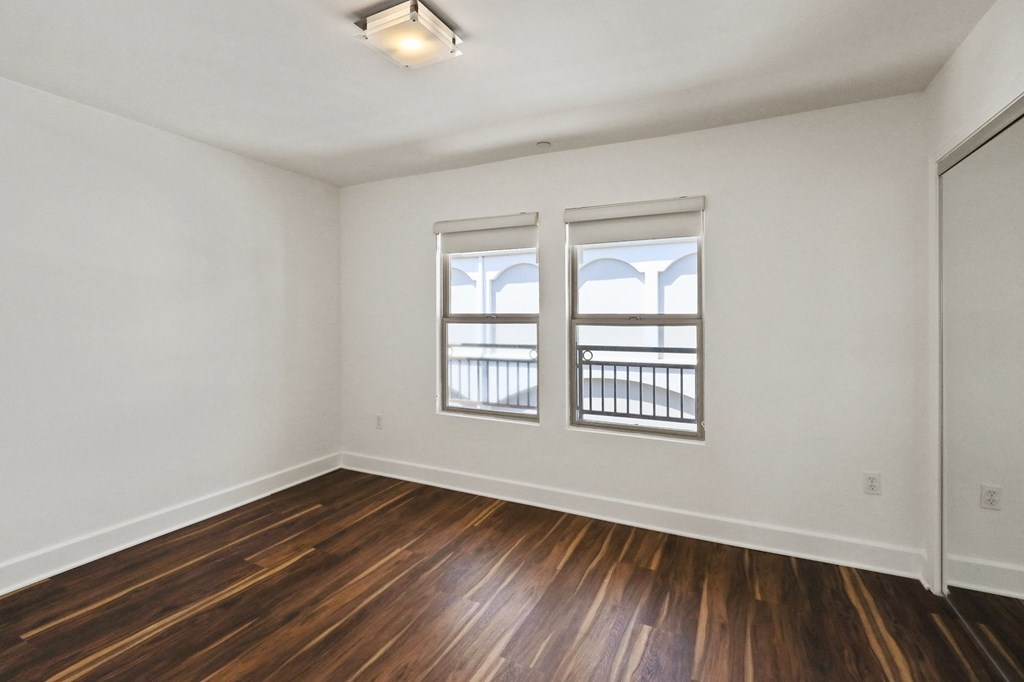 Bedroom with Double Windows and Closet