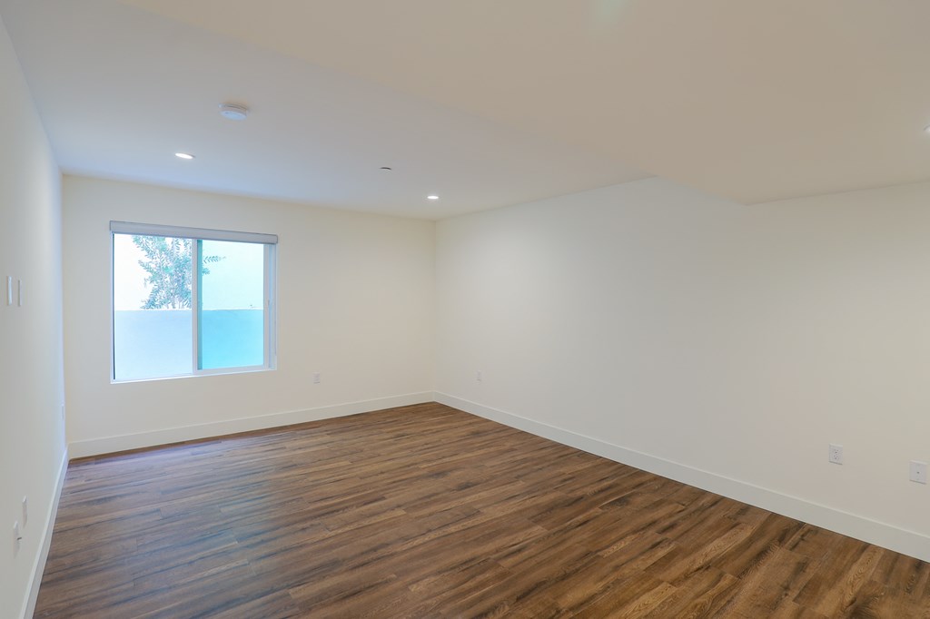 Bedroom with Recessed Lighting, Vinyl Flooring, and Windows
