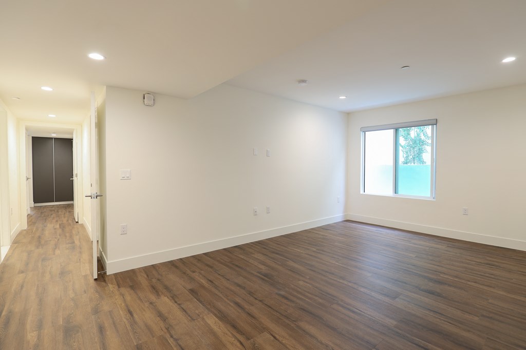 Large-Size Bedroom with Recessed Lighting, Vinyl Flooring, and Windows