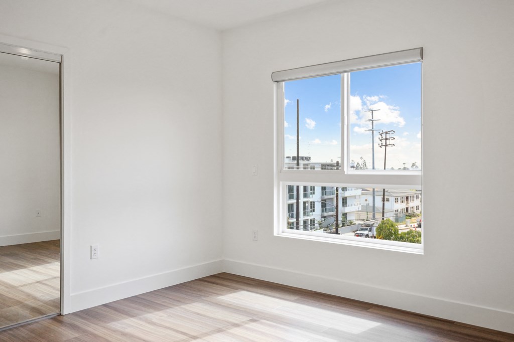Bedroom with Closet and Large Windows