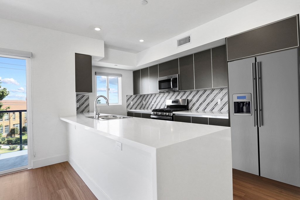 Kitchen with Energy-Efficient Refrigerator and Countertop Bar