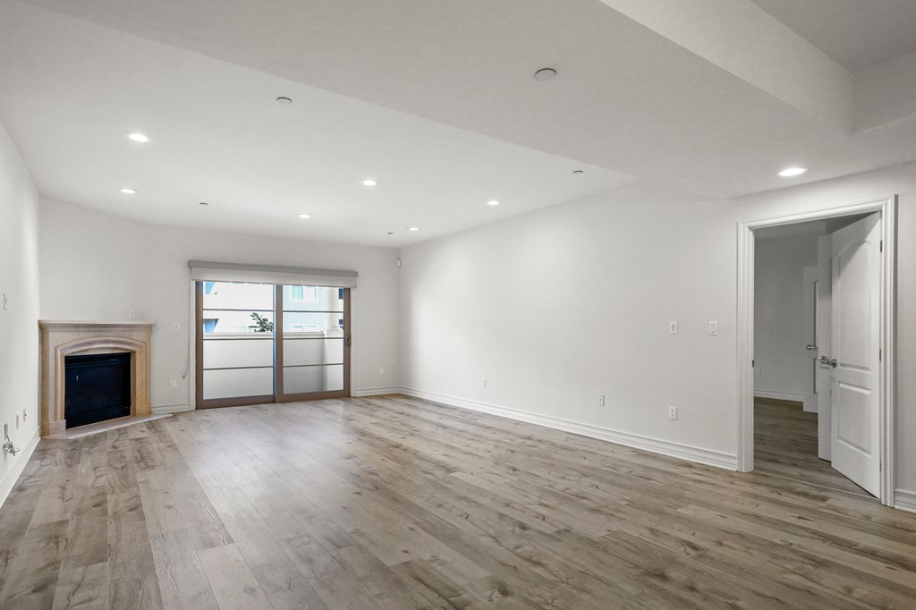 Large Living Room with a Fireplace and Balcony