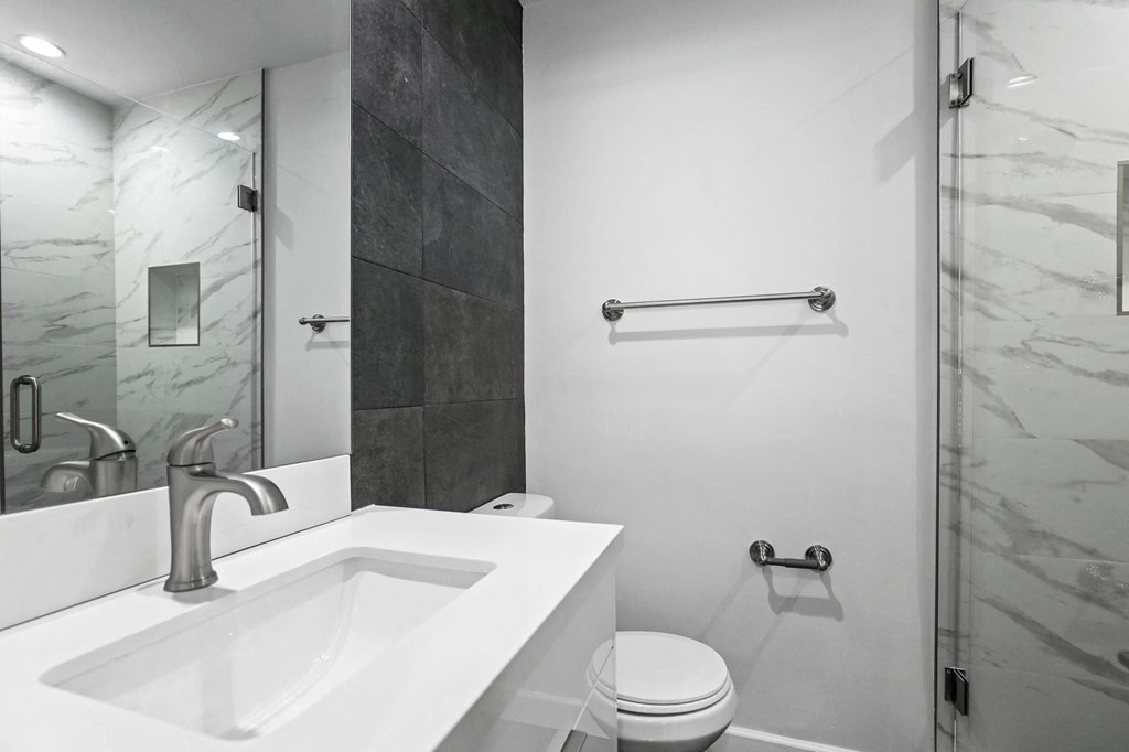 Bathroom with a Stand-Up Shower and Vanity Cabinet Storage